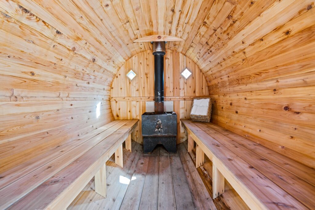  the interior of a wooden barrel sauna